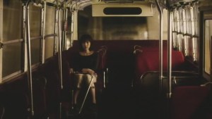 One of a couple of brilliant bus scenes.  Note the strange colour of the view out the windows and the slightly odd angle... as though the bus is forever going downhill.